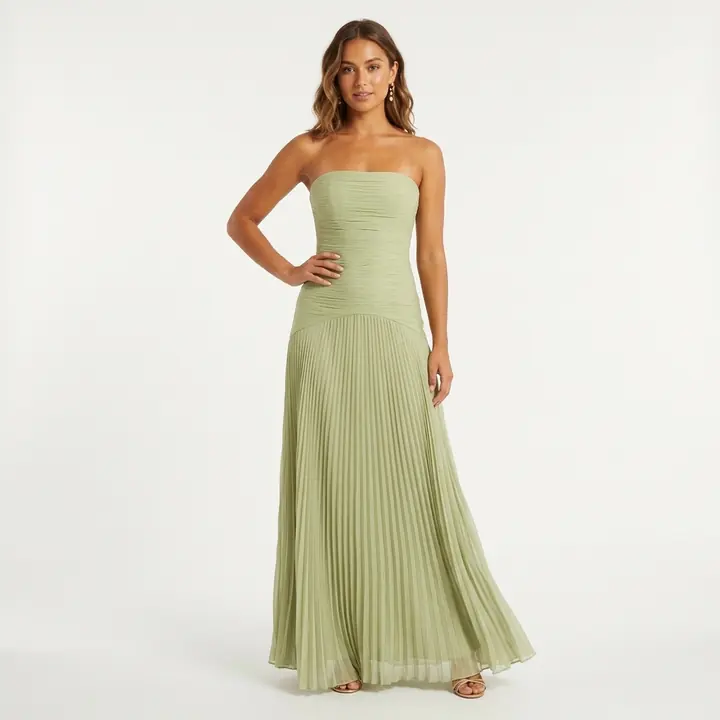 Sage pleated maxi dress on a model, white studio background